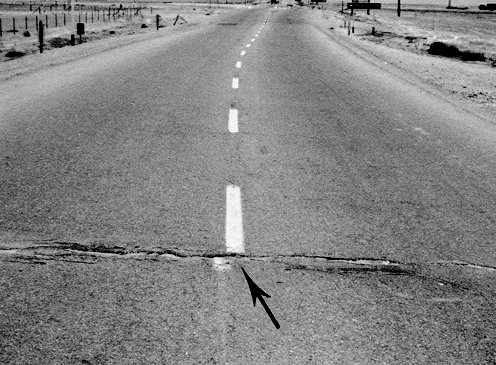 Crack across pavement of Highway 466